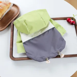 Detail of waterproof pet hooded jacket with mesh lining and adjustable drawstrings