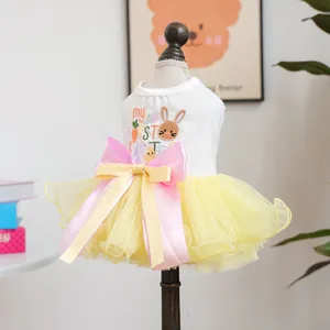Detail of Easter pet tutu dress with My First Easter print and large pink yellow bow