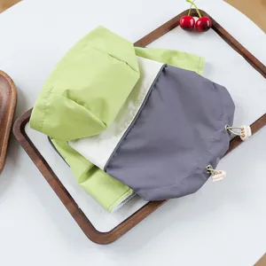 Detail of waterproof pet jacket showing breathable mesh lining and adjustable drawstring cord