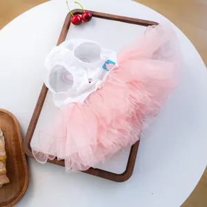 Detail view of pet Easter tutu dress featuring white fabric and layered pink mesh tulle