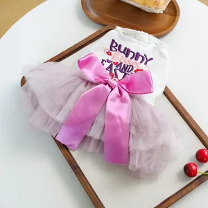 Detail of pet Easter dress featuring bunny embroidery and layered purple tulle skirt