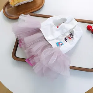 Cute pet dress for cats and dogs featuring a white button top and purple mesh tutu skirt