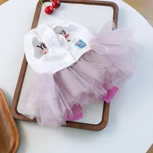 Detail of pet dress with cute bunny embroidery and pink layered tulle skirt