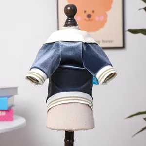 Detail view of velvet pet polo shirt with striped ribbing and a classic stand collar