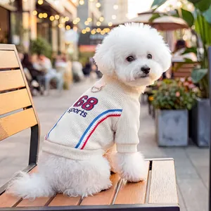 White ribbed pet sports sweater with 68 embroidery and leash D-ring on a Bichon dog