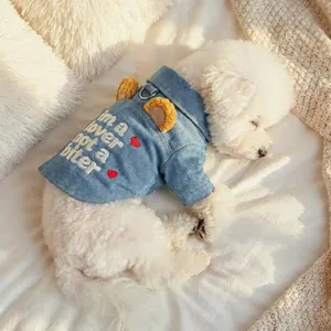 Close-up of pet denim jacket featuring bear ears and heart embroidery with a D-ring