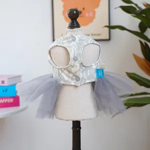 Detail of grey floral lace pet dress with triple button closure and layered mesh tutu skirt