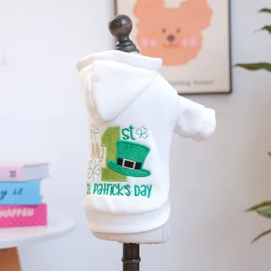Detailed embroidery of St. Patrick's Day green hat and clover on white pet hoodie