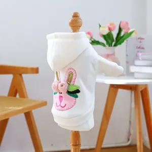 Detail of white dog hoodie with 3D floral bunny embroidery and ribbed cuffs