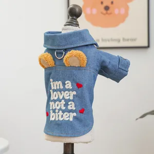 Close-up of pet denim vest featuring plush bear ears and heart embroidery on the back