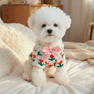 Close-up of tulip floral knit pet sweater with white lace collar and pink satin bow