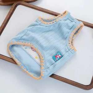 Detail of light blue ribbed pet vest featuring orange zigzag stitching and a cute side tag