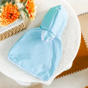 Waterproof light blue pet raincoat with hood for small dogs and cats on white background