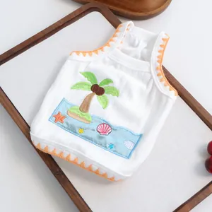 Detail of dog summer vest featuring beach embroidery, coconut tree and ribbed fabric