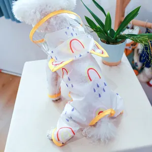 Detail of waterproof pet raincoat with rainbow prints and a clear hood for dogs and cats
