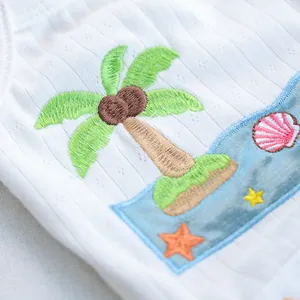 Macro view of breathable ribbed cotton fabric with colorful tropical beach embroidery