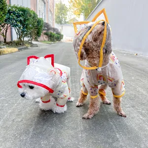 Detail of transparent pet raincoats with rainbow prints and colorful edges on dogs