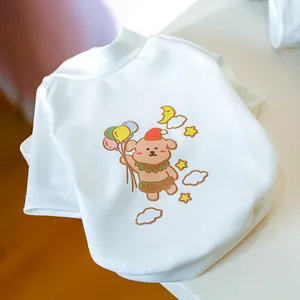 Close-up of white pet T-shirt featuring a cute cartoon bear and colorful balloons
