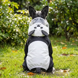 Panda-style waterproof pet raincoat with transparent hood for dogs in outdoor grass