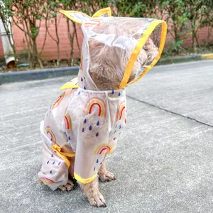 Waterproof pet raincoat with rainbow print, transparent hood and yellow trim details