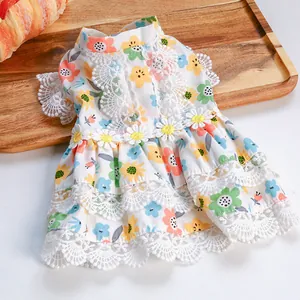 Detailed view of floral pet dress with lace edges and sunflower decor for small dogs