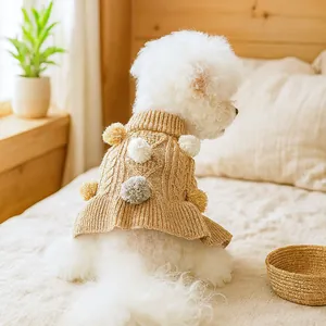 Thick khaki cable knit dog sweater with colorful pom-poms and cozy high turtleneck