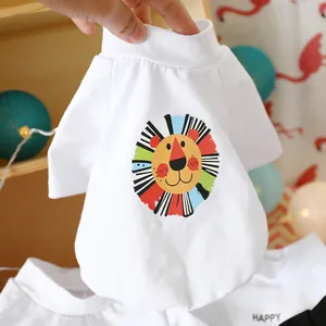 Detail of white cotton dog t-shirt featuring a colorful cartoon lion print and high collar