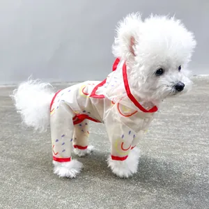 Detail of hooded rainbow dog raincoat with waterproof film and red trim protection