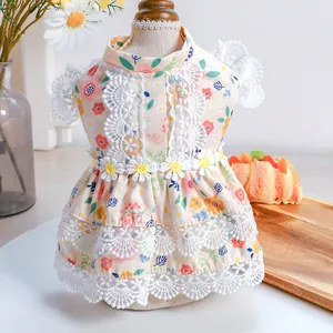 Detail of floral pet dress showing lace collar, embroidery and 3D daisy decorations