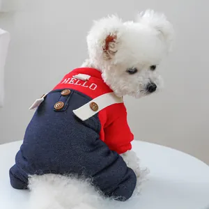 Detailed back view of red knitted dog overalls with HELLO embroidery and denim texture