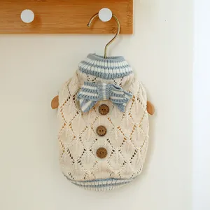 Cream knit pet sweater with blue bow and wooden buttons for small dogs and cats