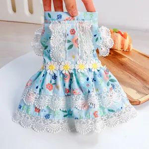 Detailed view of floral pet dress with delicate lace trim and daisy appliques