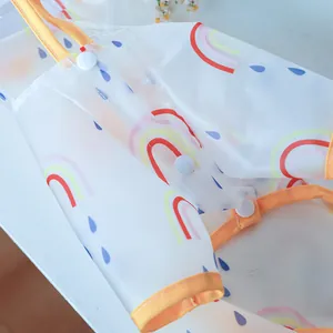 Detail of transparent waterproof EVA dog raincoat with rainbow print and snap buttons