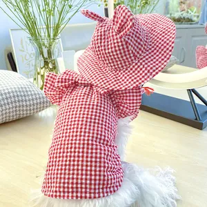 Detail of red and white plaid pet sun hat with cute rabbit ears for small dogs
