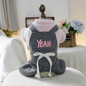 Pink plush pet sweater with grey waffle bib pants and YEAH embroidery on model