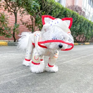 Detail of waterproof dog raincoat with transparent cat-ear hood and rainbow print
