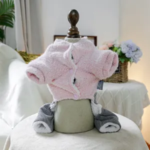 Close-up of pink knit plush jacket and grey waffle pants on a pet mannequin display