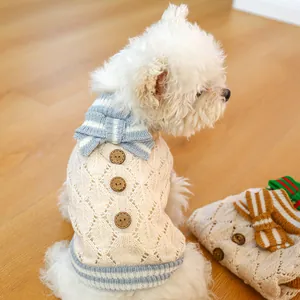 Knitted pet sweater for small dogs with wooden buttons and blue striped bow tie