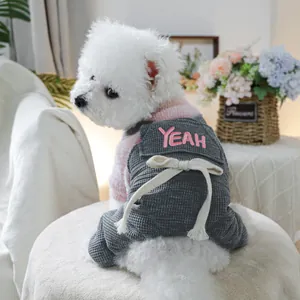 Pink knit sweater and grey waffle-textured overalls for small dogs with YEAH embroidery