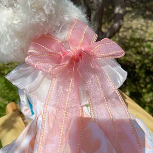 Detail of pink organza bow with yellow stitching on floral dog princess dress