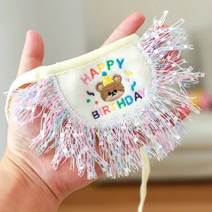 Detail of pet birthday bandana with Happy Birthday embroidery and colorful tassels