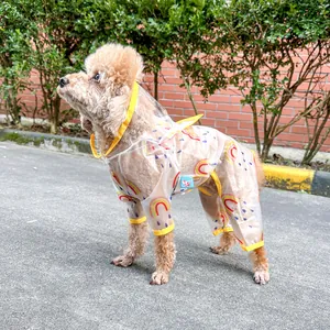 Detail of waterproof pet raincoat with colorful rainbow prints and yellow trim edges