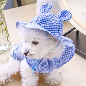 Close-up of blue gingham pet sun hat with cute ears and matching cape for small dogs