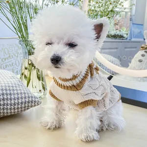Detail of warm knit pet sweater featuring hollow diamond patterns and contrast ribbing