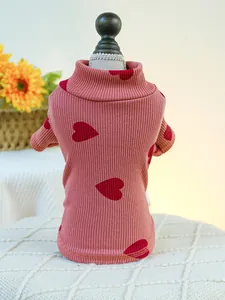 Close-up of pink ribbed pet turtleneck with red heart patterns for small dogs and cats