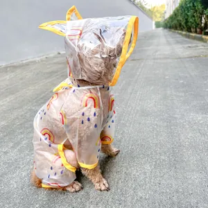 Detail of waterproof dog raincoat with rainbow print and transparent face shield