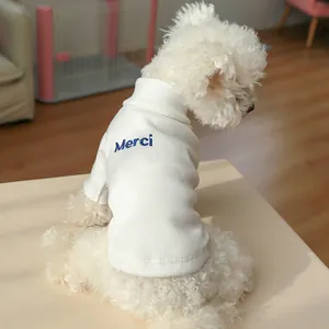 Detail of white high-neck ribbed knit pet sweater with Merci navy embroidery