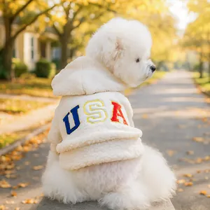 Close-up of white Sherpa fleece dog hoodie with colorful USA letter embroidery on the back