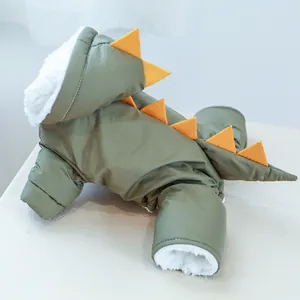 Close-up of olive green dinosaur pet hoodie showing soft white fleece lining and orange fins
