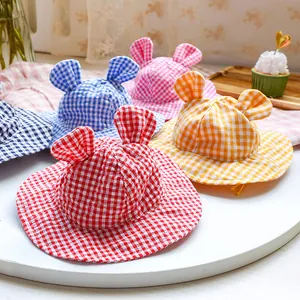Detail of plaid pet hats with animal ears in multiple colors for sun protection